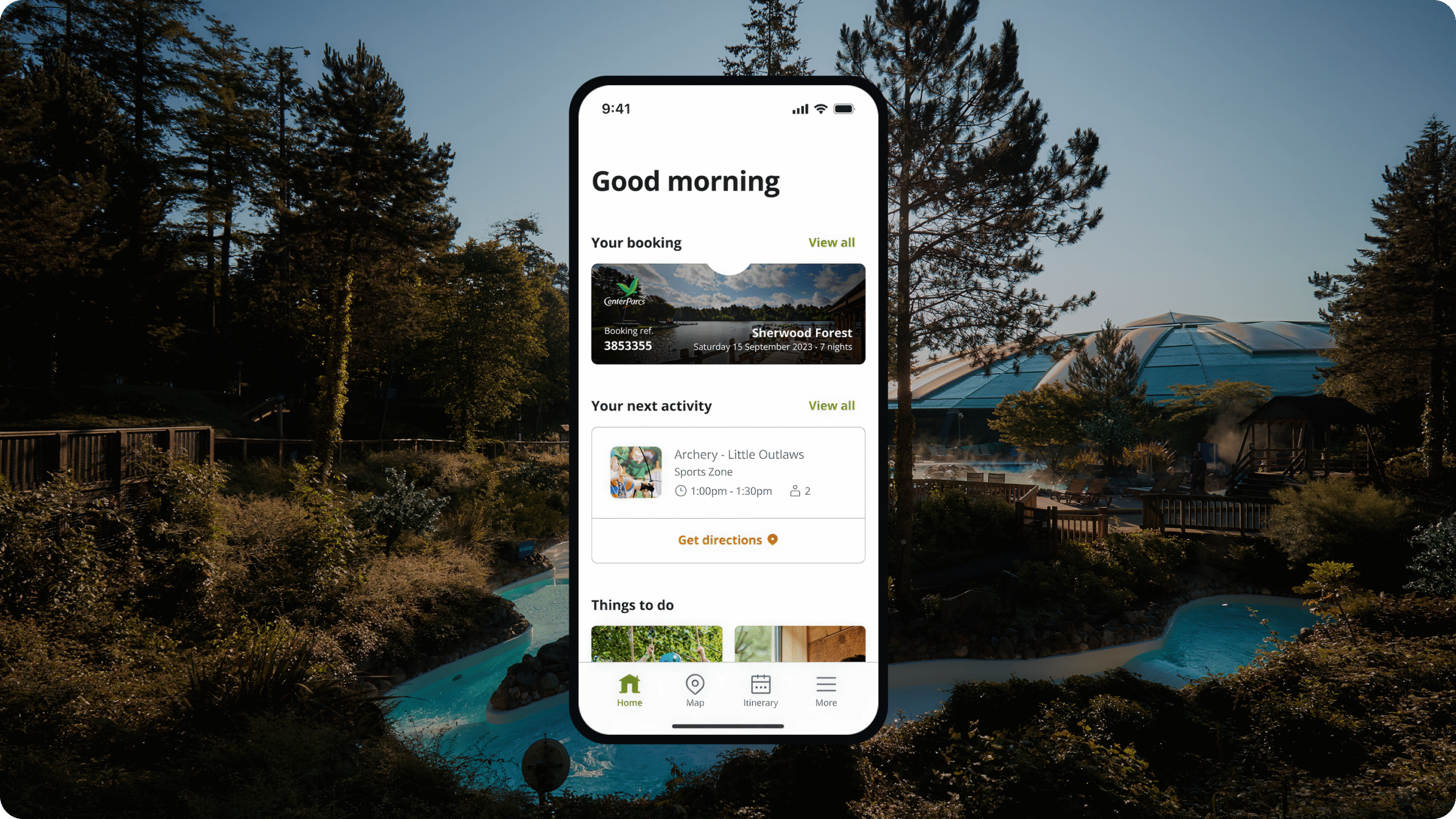 A smartphone screen displays a travel app interface with booking and activity details, overlaid on a scenic outdoor view of trees and a pool at a holiday park under clear blue skies.